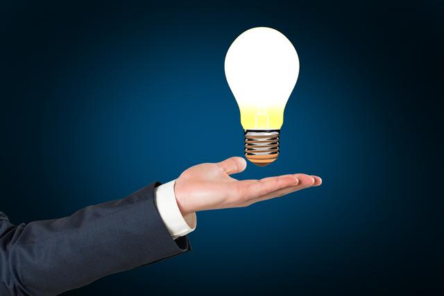 Hand holding light bulb- Download Free Stock Photos Pikwizard.com