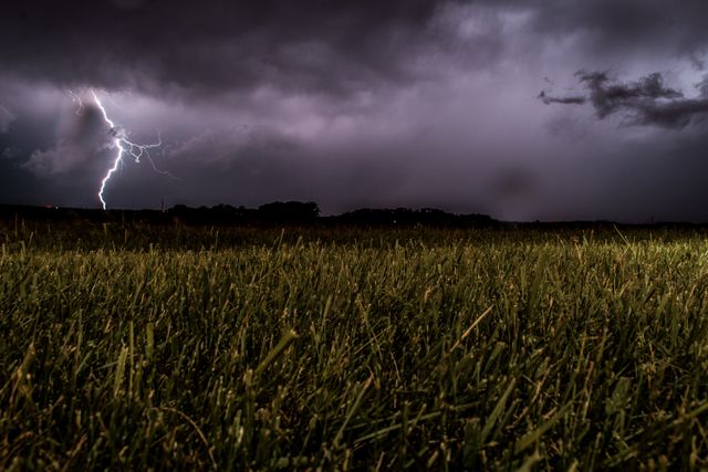 Green Fields during Night Being Struck by a Lightning - Download Free Stock Photos Pikwizard.com