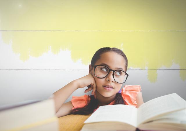 Young girl with glasses and books against painted background - Download Free Stock Photos Pikwizard.com