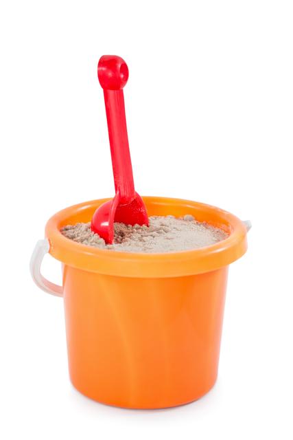 Close-up of toy bucket and spade isolated on white background