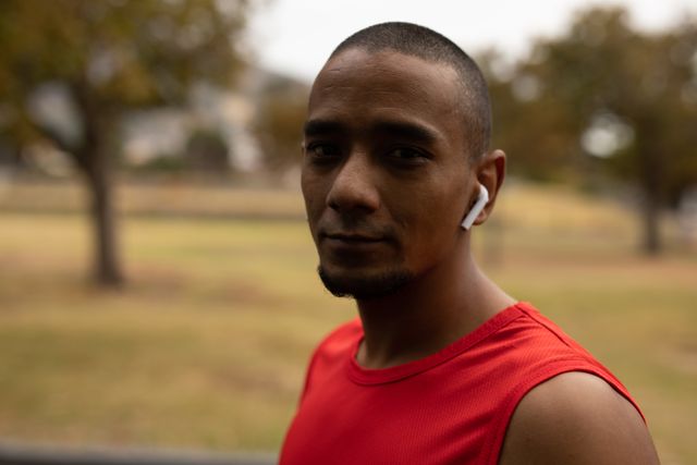 Portrait of man wearing wireless earphones outdoors - Download Free Stock Photos Pikwizard.com