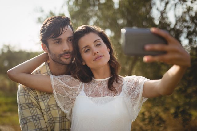 Beautiful young woman taking selfie with man - Download Free Stock Photos Pikwizard.com