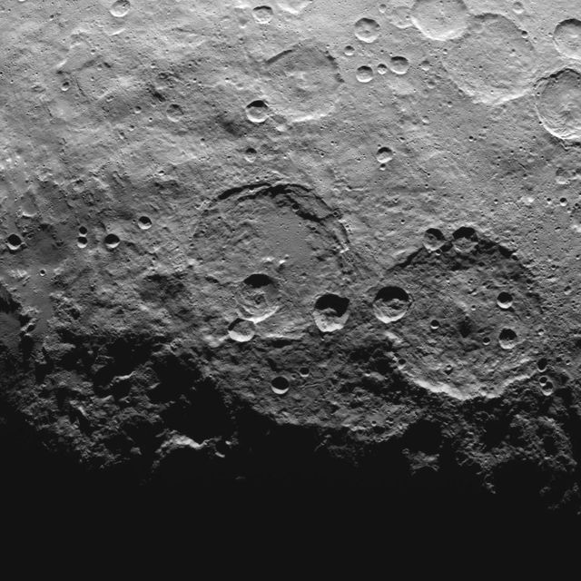 This image, taken by NASA's Dawn spacecraft, shows high southern latitudes on Ceres from an altitude of 2,700 miles (4,400 kilometers). The image, with a resolution of 1,400 feet (410 meters) per pixel, was taken on June 25, 2015. Zadeni crater, measuring about 80 miles (130 kilometers) across, is on the right side of the image.   http://photojournal.jpl.nasa.gov/catalog/PIA19634