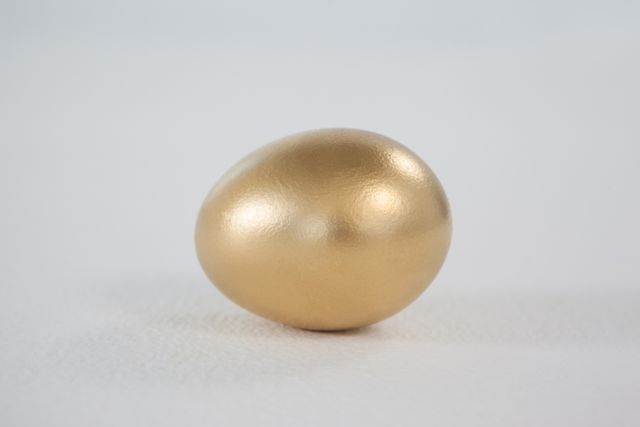 Golden eastern egg on white background - Download Free Stock Photos Pikwizard.com