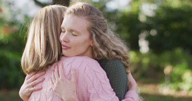 Image of smiling caucasian adult daughter and senior mother hugging in garden - Download Free Stock Photos Pikwizard.com