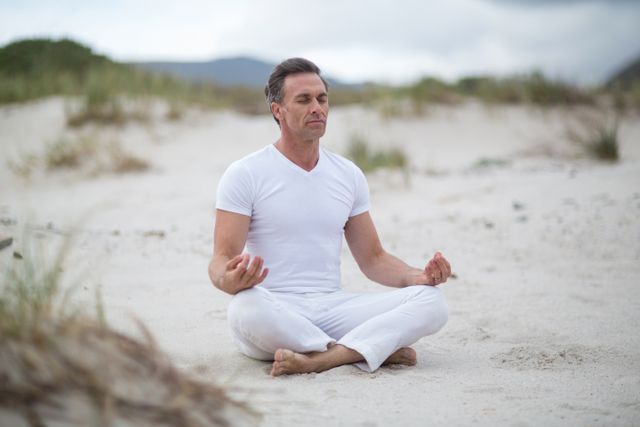 Mature man doing meditation - Download Free Stock Photos Pikwizard.com