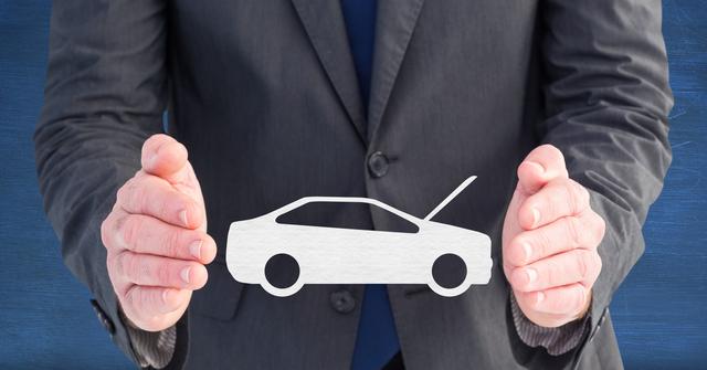 Digital composite image of businessman pretending to hold vector car sign