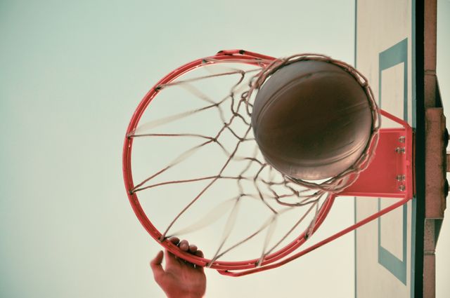 Basketball going through the Basketball hoop. Sports and fitness concept