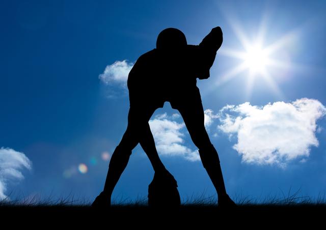 Silhouette athlete standing with rugby ball on a sunny day - Download Free Stock Photos Pikwizard.com