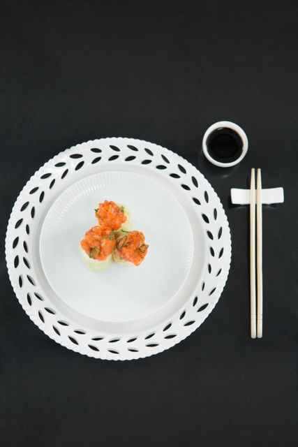 Sushi served on plate with chopsticks - Download Free Stock Photos Pikwizard.com