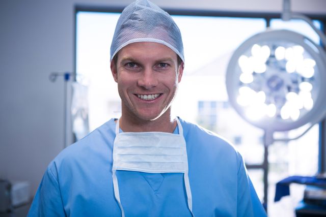Portrait of male nurse smiling in operation theater - Download Free Stock Photos Pikwizard.com