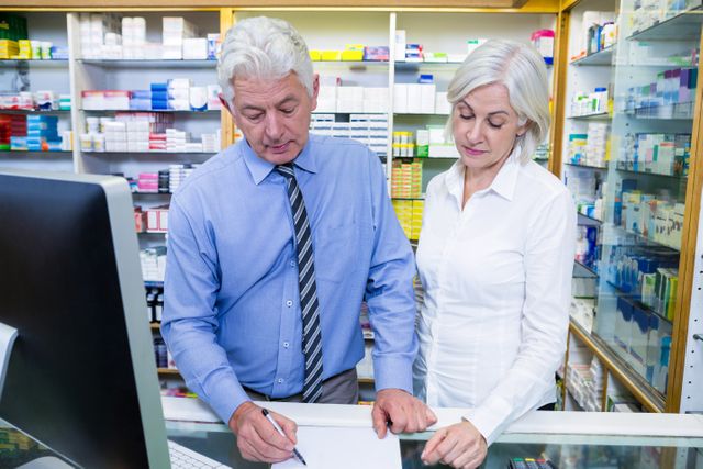 Pharmacist writing prescriptions for medicines - Download Free Stock Photos Pikwizard.com