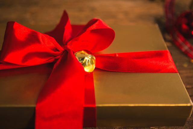 Close-up of wrapped gift on wooden table - Download Free Stock Photos Pikwizard.com