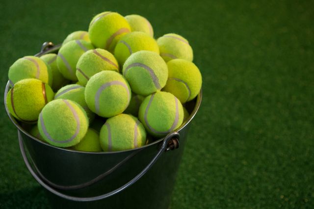 Tennis balls in bucket - Download Free Stock Photos Pikwizard.com