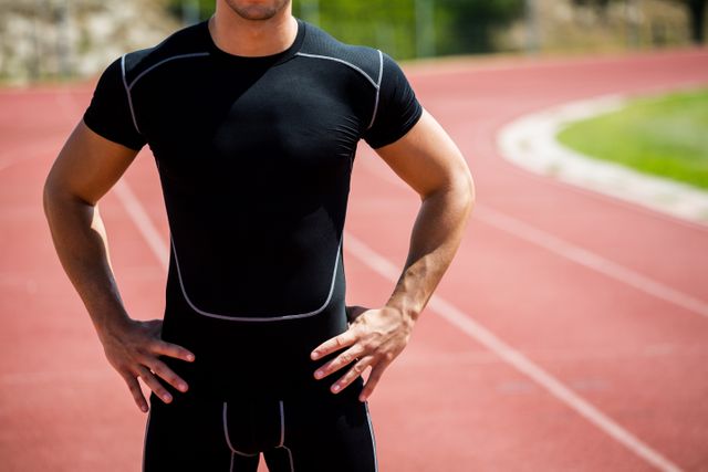 Athlete standing on running track - Download Free Stock Photos Pikwizard.com
