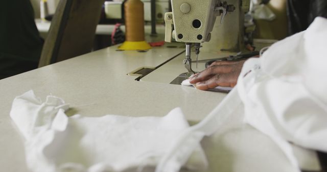 Hand of african american male tailor using sewing machine in workshop - Download Free Stock Photos Pikwizard.com
