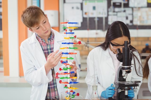 School kids experimenting molecule model in laboratory - Download Free Stock Photos Pikwizard.com