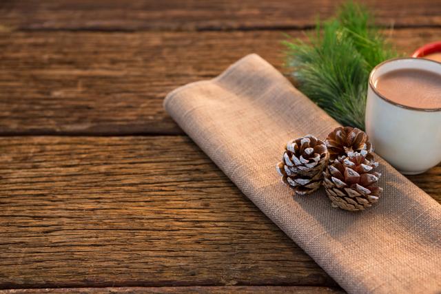 Pine cone, coffee cup, sweet food, and christmas fir with napkin - Download Free Stock Photos Pikwizard.com