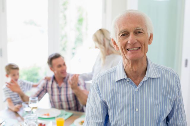 Portrait of senior man smiling at home