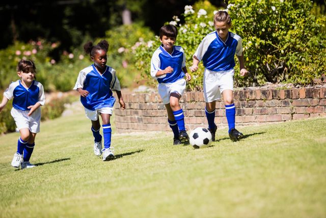 Children wearing soccer uniform playing a match - Download Free Stock Photos Pikwizard.com