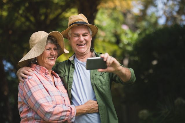 Happy senior couple taking selfie through mobile phone - Download Free Stock Photos Pikwizard.com