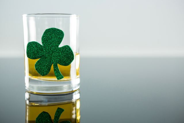 St Patricks Day glass of beer with shamrock - Download Free Stock Photos Pikwizard.com