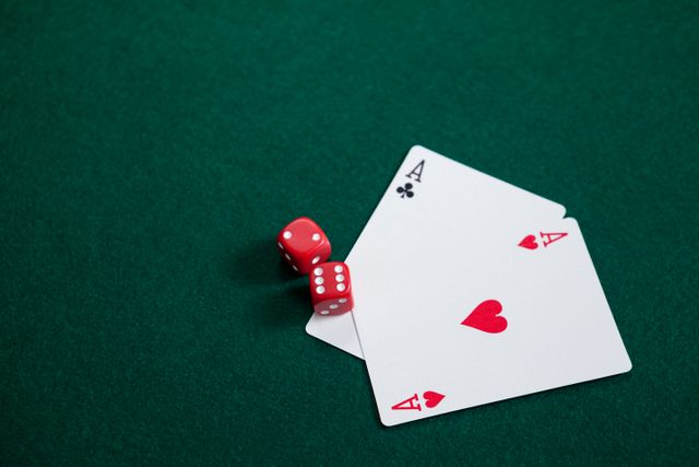 Pair of dice and playing cards on poker table - Download Free Stock Photos Pikwizard.com