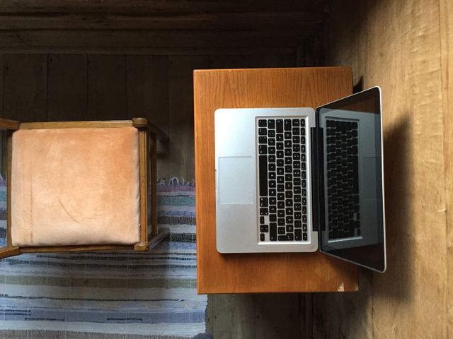 Overhead view of a laptop on wooden table. business and technology concept