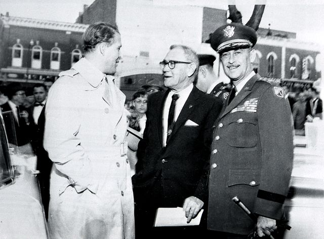 Dr. Wernher von Braun, Director of the U.S. Army Ballistic Missile Agency's (ABMA) Development Operations Division, talks to Huntsville Mayor R. B. "Speck" Searcy, center, and Army Ordnance Missile Command (ARMC) Major General John B. Medaris, right, during "Moon Day" celebrations in downtown Huntsville, Alabama. (Courtesy of Huntsville/Madison County Public Library)
