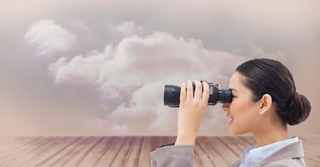 Side view of businesswoman using binoculars against sky - Download Free Stock Photos Pikwizard.com