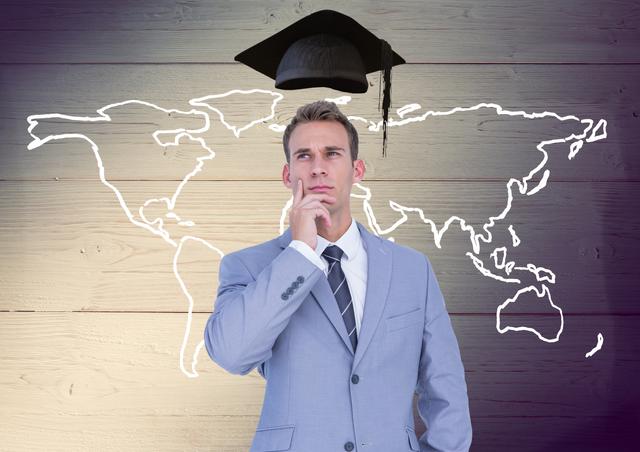 Businessman with mortarboard above head and world map against wooden background - Download Free Stock Photos Pikwizard.com