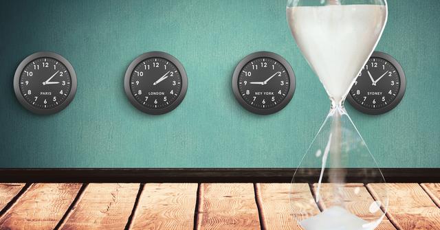Hour glass against clocks with different time zones - Download Free Stock Photos Pikwizard.com