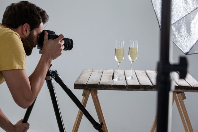 Male photographer photographing champagne glasses - Download Free Stock Photos Pikwizard.com