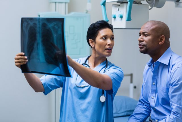 Nurse discussing x-ray with patient - Download Free Stock Photos Pikwizard.com