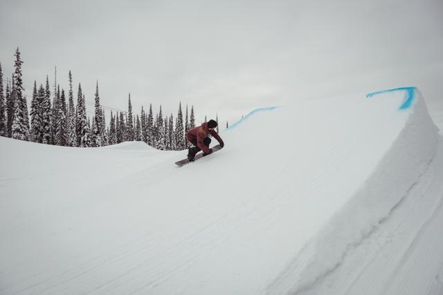 Man skiing on snowy alps in ski resort - Download Free Stock Photos Pikwizard.com