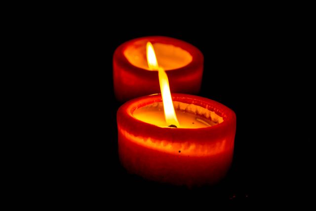 Close-up of Lit Candle over Black Background - Download Free Stock Photos Pikwizard.com