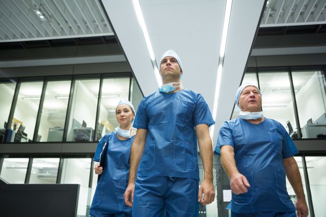 Surgeons walking in hospital - Download Free Stock Photos Pikwizard.com