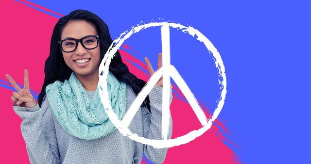 Portrait of smiling young asian woman with peace symbol on blue and pink background, copy space - Download Free Stock Photos Pikwizard.com