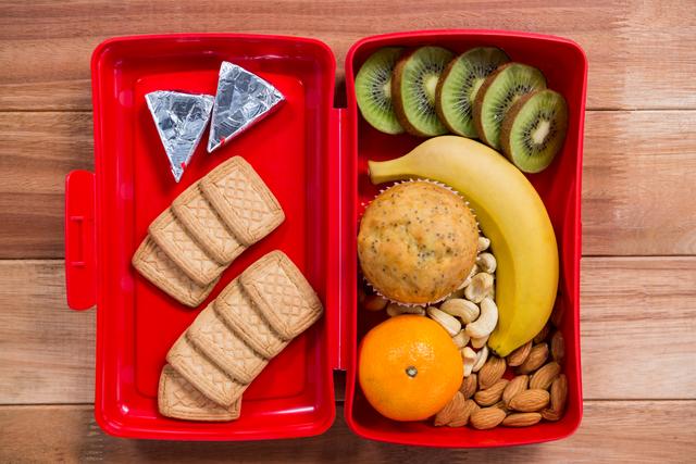 Various snack and fruit in lunch box - Download Free Stock Photos Pikwizard.com