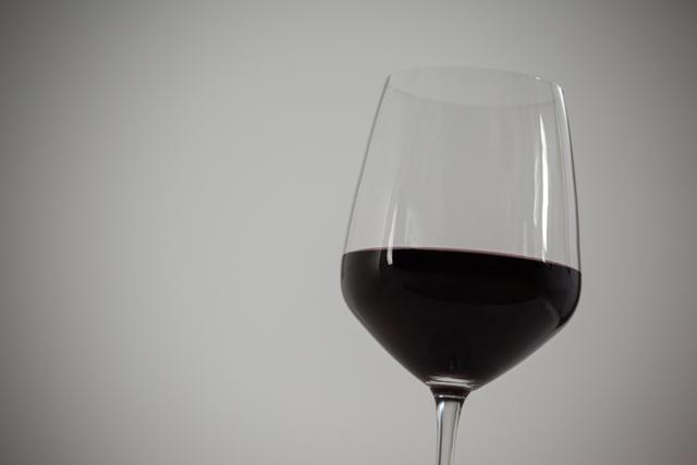Close-up of red wine against white background - Download Free Stock Photos Pikwizard.com