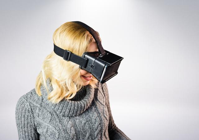 Woman using virtual reality headset - Download Free Stock Photos Pikwizard.com