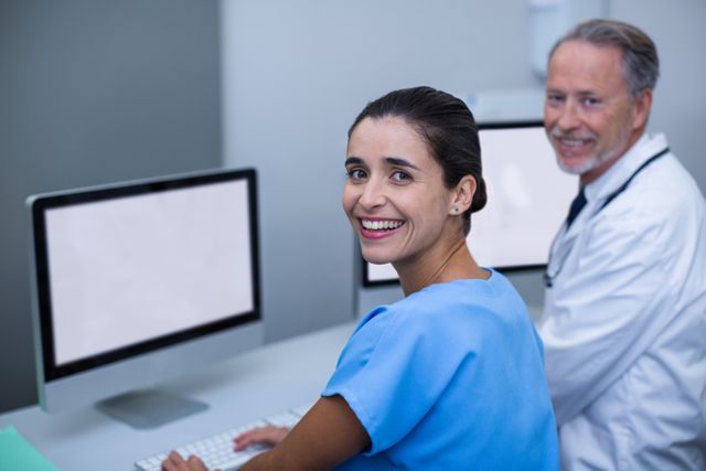 Doctor and nurse working on computer - Download Free Stock Photos Pikwizard.com