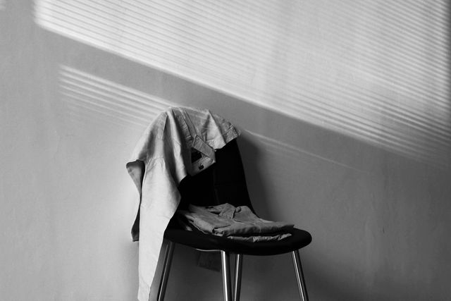 Black and white clothes on chair - Download Free Stock Photos Pikwizard.com