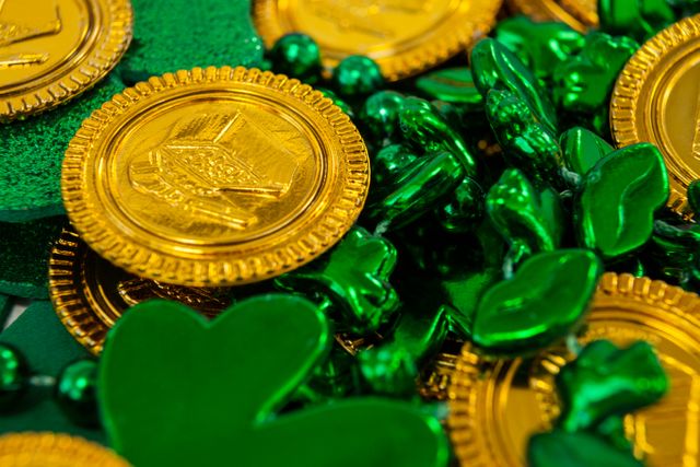 St. Patricks Day chocolate gold coins, beads and shamrocks - Download Free Stock Photos Pikwizard.com