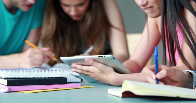 Students combine teamwork and technology in their study session. from ...