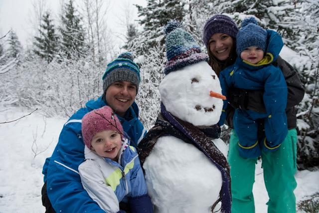 Portrait of happy parents and children with snowman - Download Free Stock Photos Pikwizard.com