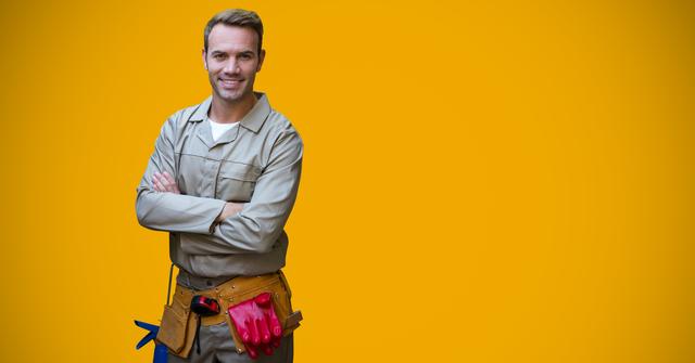 Portrait of handyman standing with arms crossed - Download Free Stock Photos Pikwizard.com