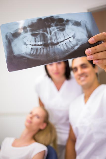 Dentists discussing over dental x-ray report - Download Free Stock Photos Pikwizard.com