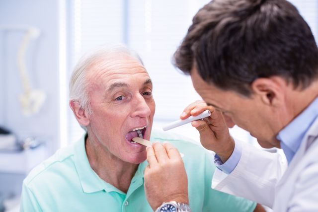 Doctor examining senior patients mouth - Download Free Stock Photos Pikwizard.com