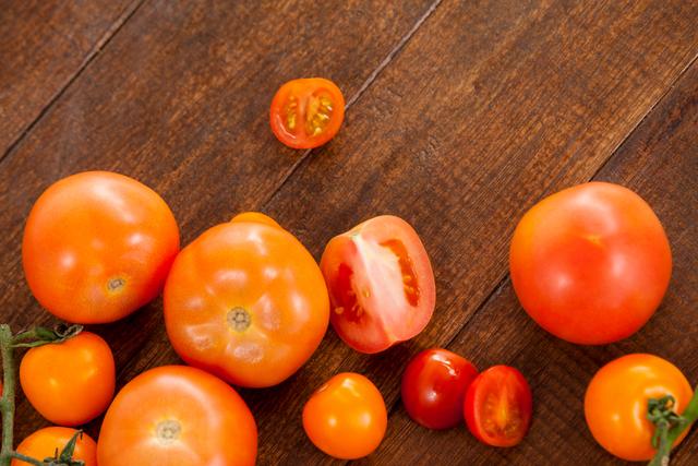 Various types of tomatoes on table - Download Free Stock Photos Pikwizard.com